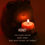 Cute bear candle holder with honey jar candle creating a warm and sweet candlelight atmosphere