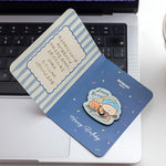 BigGallery Birthday Badge July design displayed on a greeting card, cute birthday badge collectible for bags and outfits