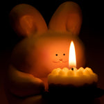 Lit bunny candle holder creating a warm and cozy atmosphere with scented candle light