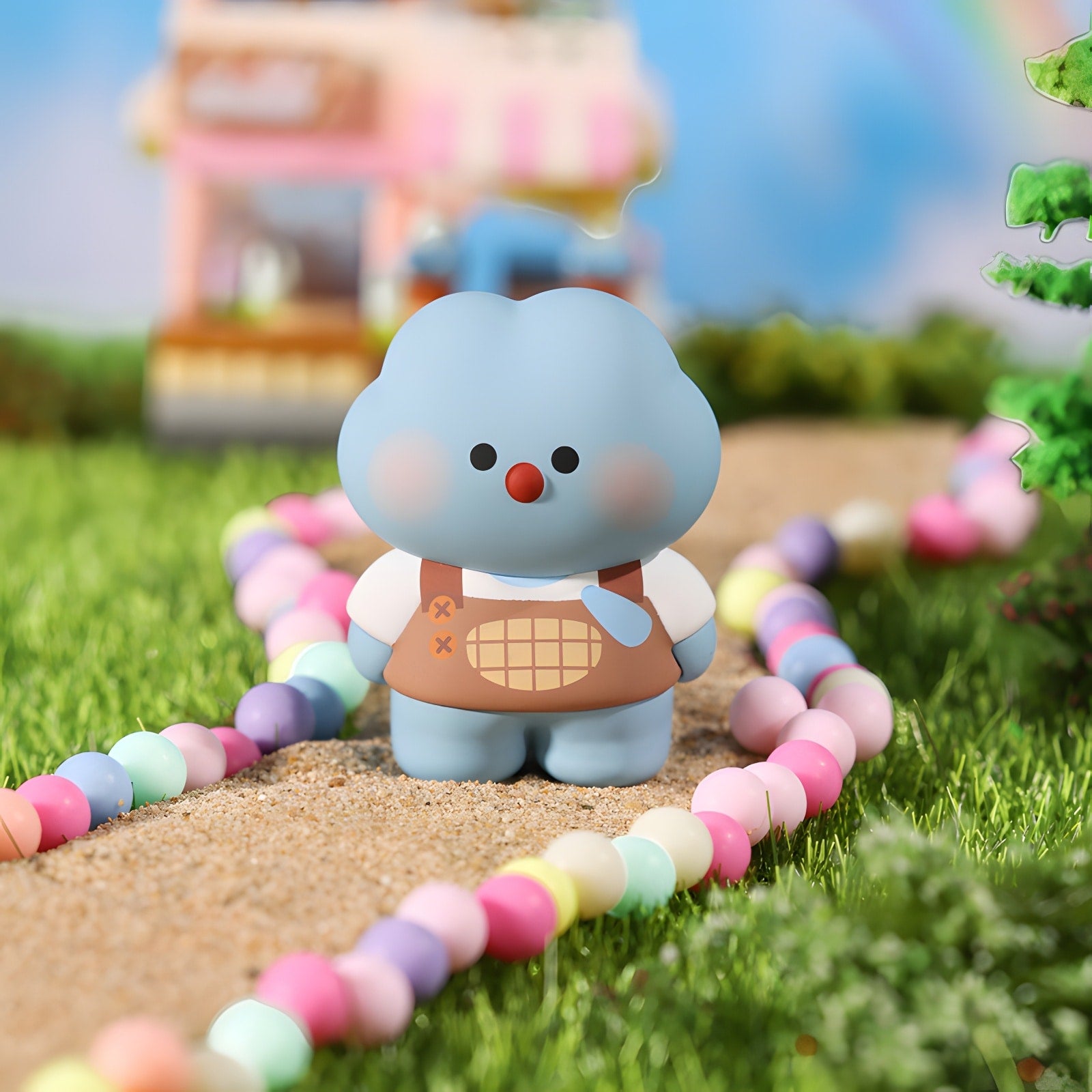 NINIGOGO Happy Day blue character figure in outdoor scene with colorful beads path and playful collectible toy setting