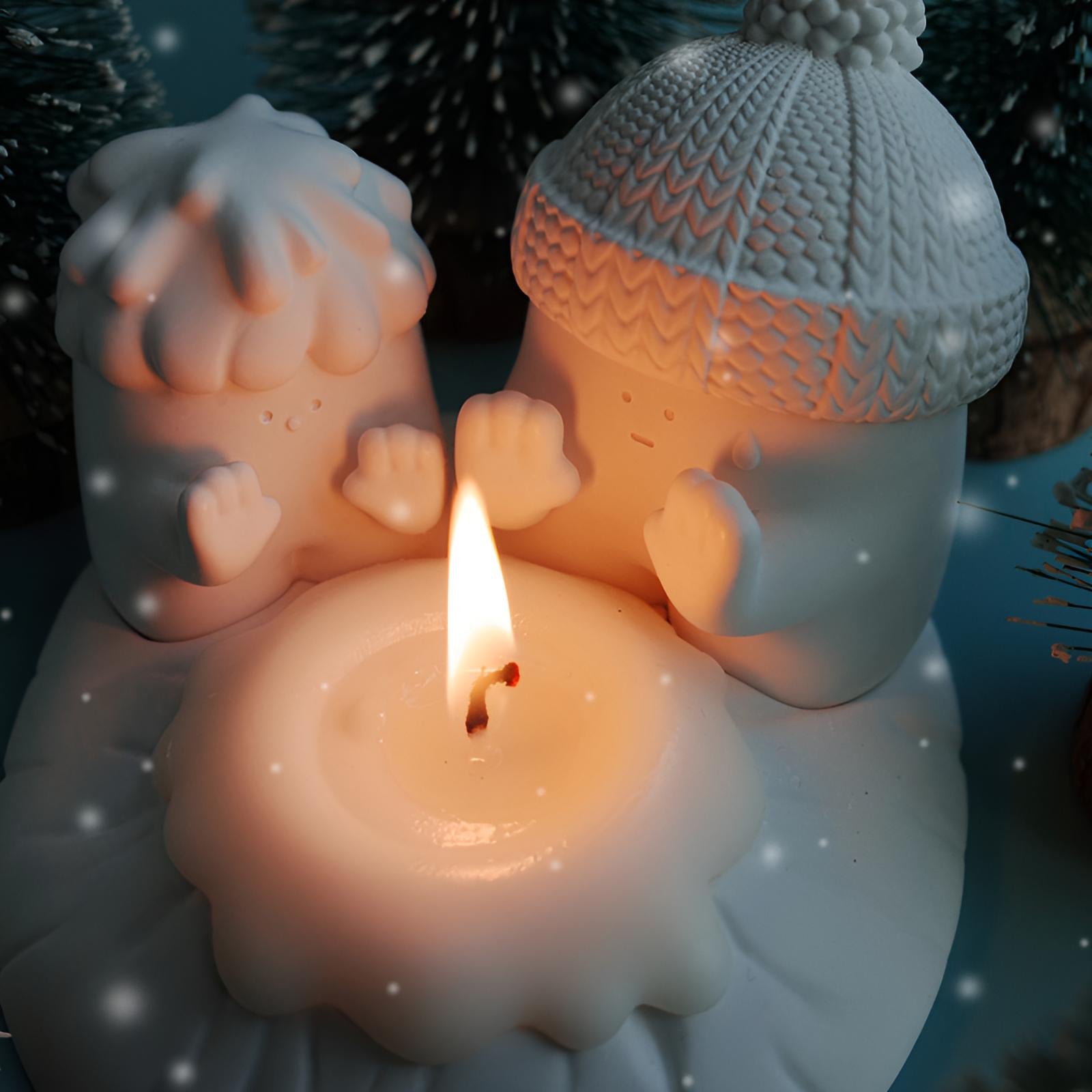 Snowman candle holder set shown in a cozy candlelight winter scene with soft glowing details