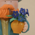 Close-up detail of Van Gogh & Irises collectible figure featuring blue iris flowers and artist-inspired design